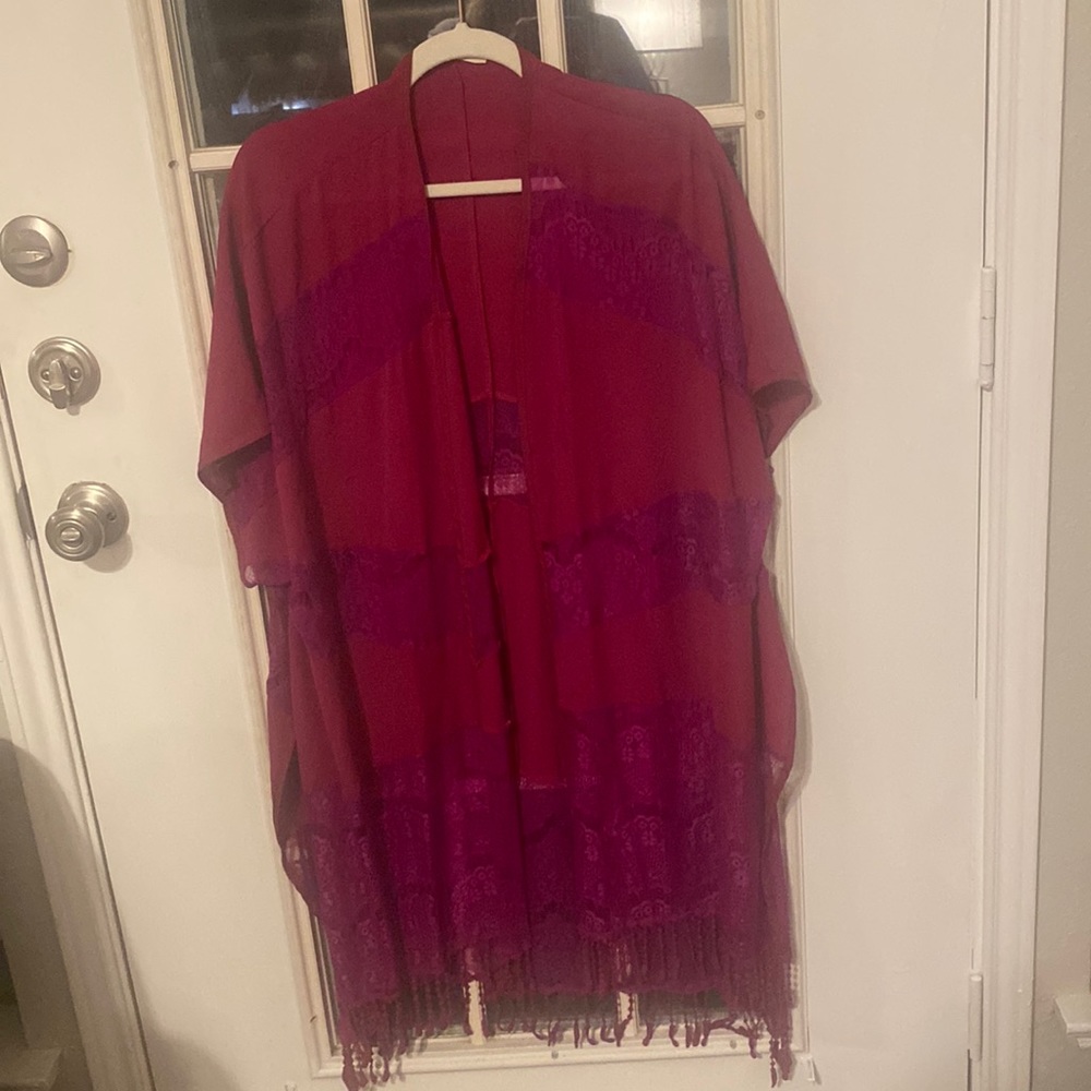This piece is unique! . It has fringe on bottom and panels of lace!